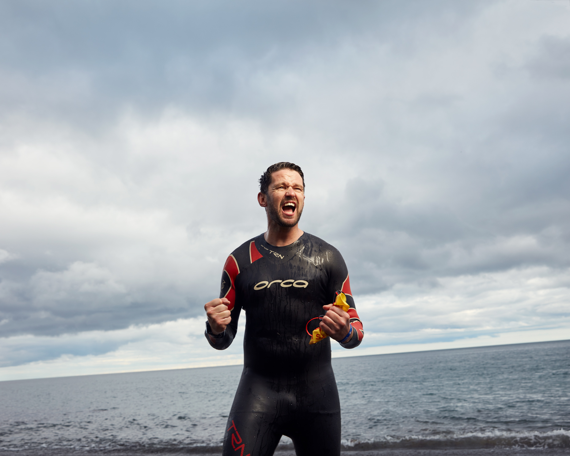 athlete portraits: focused triathlete in wetsuit