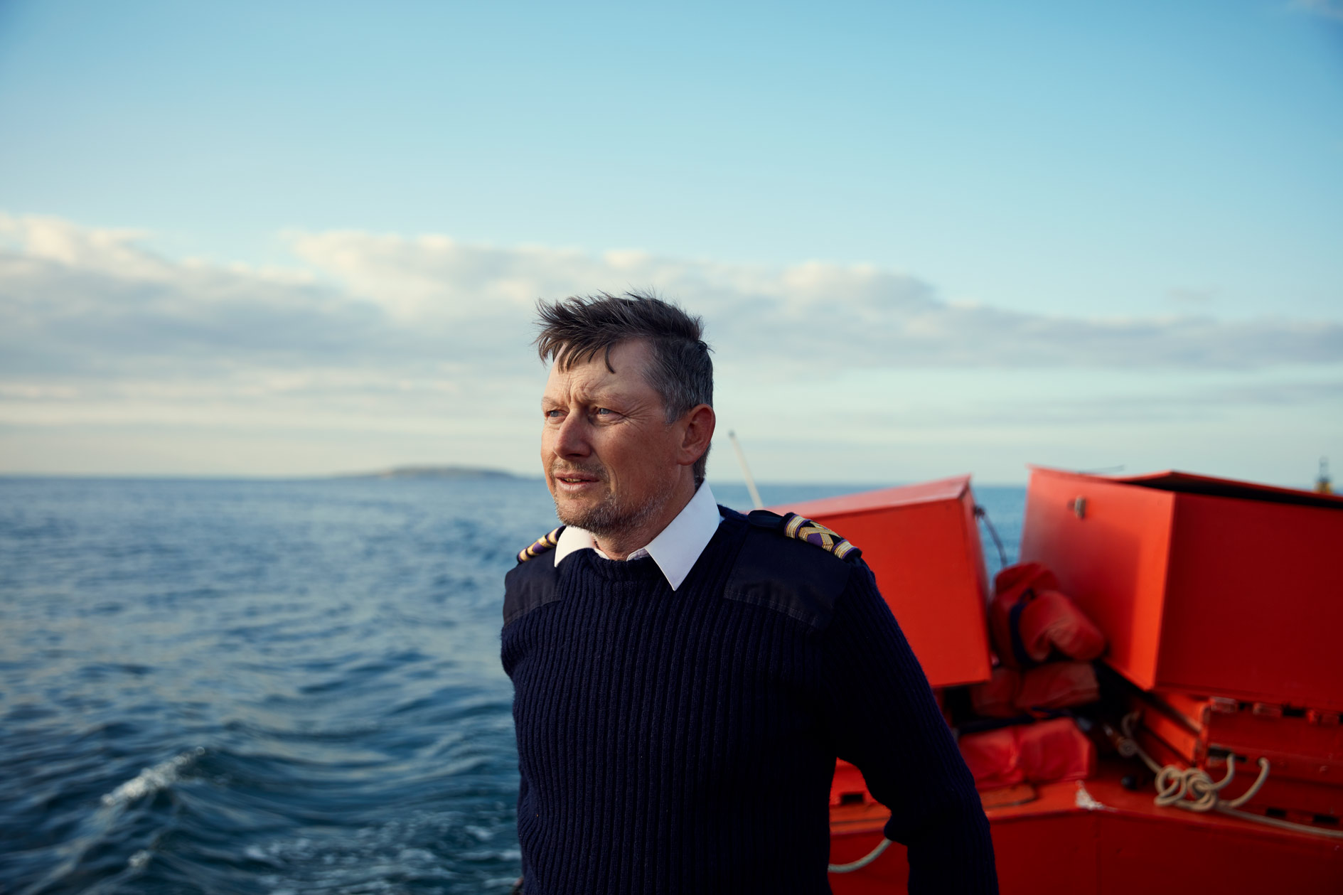 storytelling photography of a  fisherman at  sea
