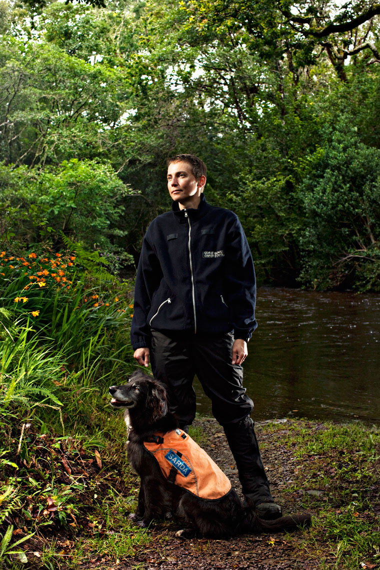 portrait photography:  coast guard dog and trainer in forest